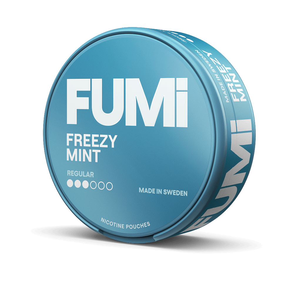 A round blue tin of FUMi Freezy Mint nicotine pouches on a solid black background. The packaging features bold white text with the brand name 'FUMi' and product name 'FREEZY MINT'.