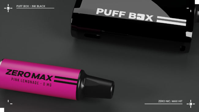 Black Puff Box vape device laid flat behind a ZERO MAX Pink Lemonade pod in pink colour